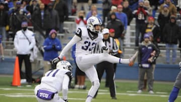 Nov 15, 2014; Lawrence, KS, USA; TCU Horned Frogs place kicker Jaden Oberkrom (33) kicks a field goal against the Kansas Jayhawks in the first half at Memorial Stadium. Mandatory Credit: John Rieger-USA TODAY Sports