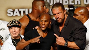 LAS VEGAS - SEPTEMBER 18: (L-R) Cornerman Rafael Garcia, boxer Floyd Mayweather Jr. and WWE wrestler Triple H pose during the official weigh-in for Mayweather's fight against Juan Manuel Marquez at the MGM Grand Garden Arena September 18, 2009 in Las Vegas, Nevada. The two will fight at the MGM on September 19. (Photo by Ethan Miller/Getty Images)