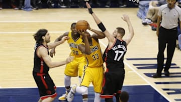 Apr 21, 2016; Indianapolis, IN, USA; Indiana Pacers center Myles Turner (33) takes a shot against Toronto Raptors center Jonas Valanciunas (17) in the second half in game three of the first round of the 2016 NBA Playoffs at Bankers Life Fieldhouse. Toronto defeated Indiana 101-85. Mandatory Credit: Brian Spurlock-USA TODAY Sports