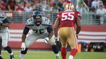October 22, 2015; Santa Clara, CA, USA; Seattle Seahawks tackle Russell Okung (76) blocks San Francisco 49ers outside linebacker Ahmad Brooks (55) during the first quarter at Levi