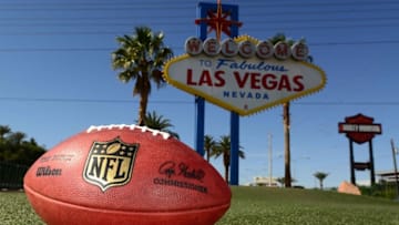 May 11, 2016; Las Vegas, NV, USA; General view of NFL Wilson Duke football at the "Welcome to Fabulous Las Vegas" sign on the Las Vegas strip on Las Vegas Blvd. Oakland Raiders owner Mark Davis (not pictured) has pledged $500 million toward building a 65,000-seat domed stadium in Las Vegas at a total cost of $1.4 billion. NFL commissioner Roger Goodell (not pictured) said Davis can explore his options in Las Vegas but would require 24 of 32 owners to approve the move. Mandatory Credit: Kirby Lee-USA TODAY Sports