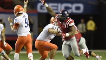 Aug 28, 2014; Atlanta, GA, USA; Mississippi Rebels defensive tackle Robert Nkemdiche (5) presses Boise State Broncos quarterback Grant Hedrick (9) in the fourth quarter of the 2014 Chick-fil-a Kickoff Game at the Georgia Dome. Mandatory Credit: Dale Zanine-USA TODAY Sports