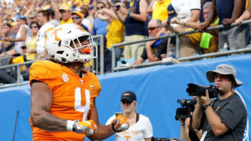CHARLOTTE, NC - SEPTEMBER 01: Dominick Wood-Anderson #4 of the Tennessee Volunteers reacts after scoring a touchdown against the West Virginia Mountaineers during their game at Bank of America Stadium on September 1, 2018 in Charlotte, North Carolina. (Photo by Streeter Lecka/Getty Images)