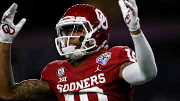 ARLINGTON, TEXAS - DECEMBER 30: Wide receiver Theo Wease #10 of the Oklahoma Sooners celebrates a touchdown against the Florida Gators during the second quarter at AT&T Stadium on December 30, 2020 in Arlington, Texas. (Photo by Tom Pennington/Getty Images)
