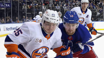 NEW YORK, NEW YORK - DECEMBER 22: Alexis Lafreniere #13 of the New York Rangers skates against Sebastian Aho #25 of the New York Islanders during the second period at Madison Square Garden on December 22, 2022 in New York City. (Photo by Bruce Bennett/Getty Images)