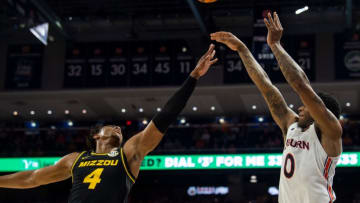 Auburn basketball guard K.D. Johnson (0) takes a jump shot as Auburn Tigers take on Missouri Tigers at Neville Arena in Auburn, Ala., on Tuesday, Feb. 14, 2023. Auburn Tigers lead Missouri Tigers 45-18 at halftime.