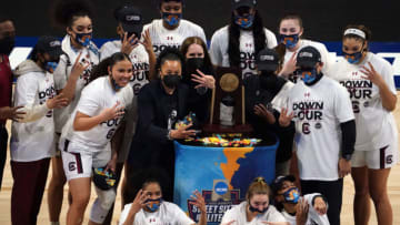 Mar 30, 2021; San Antonio, Texas, USA; South Carolina Gamecocks players and coach Dawn Staley pose with the regional champion trophy after defeating the Texas Longhorns at Alamodome. Mandatory Credit: Kirby Lee-USA TODAY Sports