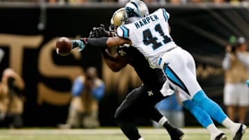 Dec 7, 2014; New Orleans, LA, USA; Carolina Panthers strong safety Roman Harper (41) breaks up a pass to New Orleans Saints tight end Benjamin Watson (82) during the second half of a game at the Mercedes-Benz Superdome. The Panthers defeated the Saints 41-10. Mandatory Credit: Derick E. Hingle-USA TODAY Sports
