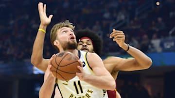 Feb 6, 2022; Cleveland, Ohio, USA; Indiana Pacers forward Domantas Sabonis (11) drives to the basket against Cleveland Cavaliers center Jarrett Allen (31) during the first quarter at Rocket Mortgage FieldHouse. Mandatory Credit: Ken Blaze-USA TODAY Sports