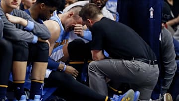 Feb 26, 2016; Dallas, TX, USA; Denver Nuggets forward Danilo Gallinari (8) sits in pain after injuring himself during the second half against the Dallas Mavericks at American Airlines Center. Mandatory Credit: Kevin Jairaj-USA TODAY Sports