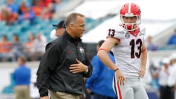 Nov 2, 2013; Jacksonville, FL, USA; Georgia Bulldogs head coach Mark Richt and kicker Marshall Morgan (13) against the Florida Gators prior to the game at EverBank Field. Mandatory Credit: Kim Klement-USA TODAY Sports