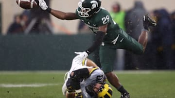 EAST LANSING, MI - OCTOBER 20: Shakur Brown #29 of the Michigan State Spartans fumbles the ball during a punt return while being tackled by Jordan Glasgow #29 of the Michigan Wolverines at Spartan Stadium on October 20, 2018 in East Lansing, Michigan. Michigan won the game 21-7. (Photo by Gregory Shamus/Getty Images)