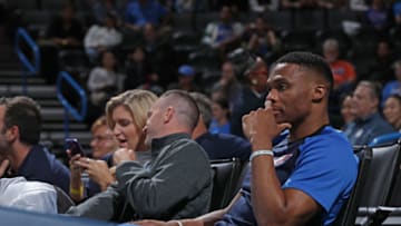 OKLAHOMA CITY, OK - OCTOBER 9: Russell Westbrook #0 of the Oklahoma City Thunder watches the game from the stands during a pre-season game against the Milwaukee Bucks on October 9, 2018 at Chesapeake Energy Arena in Oklahoma City, Oklahoma. NOTE TO USER: User expressly acknowledges and agrees that, by downloading and/or using this photograph, user is consenting to the terms and conditions of the Getty Images License Agreement. Mandatory Copyright Notice: Copyright 2018 NBAE (Photo by Zach Beeker/NBAE via Getty Images)