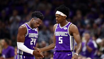 SACRAMENTO, CALIFORNIA - OCTOBER 25: Buddy Hield #24 congratulates De'Aaron Fox #5 of the Sacramento Kings after he made a basket during their game against the Portland Trail Blazers at Golden 1 Center on October 25, 2019 in Sacramento, California. NOTE TO USER: User expressly acknowledges and agrees that, by downloading and or using this photograph, User is consenting to the terms and conditions of the Getty Images License Agreement. (Photo by Ezra Shaw/Getty Images)