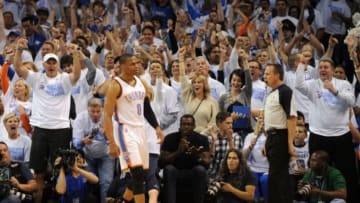 Apr 29, 2014; Oklahoma City, OK, USA; Oklahoma City Thunder guard Russell Westbrook (0) and fans react after a dunk against the Memphis Grizzlies during the first quarter in game five of the first round of the 2014 NBA Playoffs at Chesapeake Energy Arena. Mandatory Credit: Mark D. Smith-USA TODAY Sports