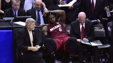 Jun 5, 2014; San Antonio, TX, USA; Miami Heat forward LeBron James (6) reacts on the bench after an injury in the fourth quarter against the San Antonio Spurs in game one of the 2014 NBA Finals at AT&T Center. The Spurs beat the Heat 110-95. Mandatory Credit: Bob Donnan-USA TODAY Sports