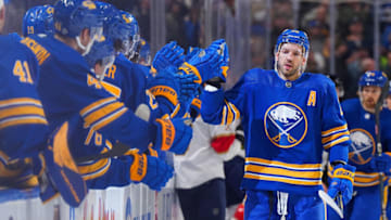 BUFFALO, NY - OCTOBER 15: Zemgus Girgensons #28 of the Buffalo Sabres celebrates a goal with teammates on the bench during the first period of the game against the Florida Panthers at KeyBank Center on October 15, 2022 in Buffalo, New York. (Photo by Kevin Hoffman/Getty Images)