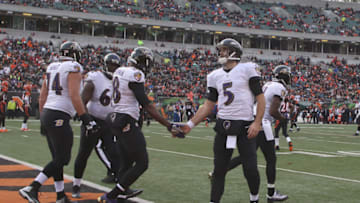 CINCINNATI, OH - JANUARY 01: Joe Flacco #5 of the Baltimore Ravens celebrates a touchdown with teammate Breshad Periman #18 during their game against the Cincinnati Bengals at Paul Brown Stadium on January 1, 2017 in Cincinnati, Ohio.The Bengals defeated the Ravens 27-10. (Photo by John Grieshop/Getty Images)