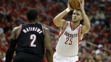 Apr 30, 2014; Houston, TX, USA; Houston Rockets forward Chandler Parsons (25) is defended by Portland Trail Blazers guard Wesley Matthews (2) during the second quarter in game five of the first round of the 2014 NBA Playoffs at Toyota Center. Mandatory Credit: Andrew Richardson-USA TODAY Sports