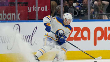 Mar 13, 2023; Toronto, Ontario, CAN; Buffalo Sabres forward JJ Peterka (77) controls the puck against the Toronto Maple Leafs during the third period at Scotiabank Arena. Mandatory Credit: John E. Sokolowski-USA TODAY Sports