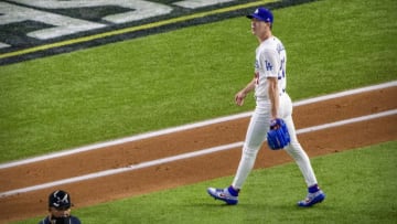 Los Angeles Dodgers starting pitcher Walker Buehler walks off the field after the second inning against the Atlanta Braves during game one of the 2020 NLCS at Globe Life Field. Mandatory Credit: Jerome Miron-USA TODAY Sports