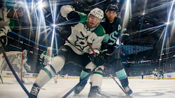 SEATTLE, WASHINGTON - MARCH 13: Joel Hanley #44 of the Dallas Stars and Jordan Eberle #7 of the Seattle Kraken battle for the puck during the first period at Climate Pledge Arena on March 13, 2023 in Seattle, Washington. (Photo by Steph Chambers/Getty Images)