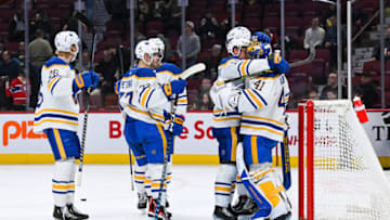 Nov 22, 2022; Montreal, Quebec, CAN; Buffalo Sabres players gather around Buffalo Sabres goalie Craig Anderson (41) to celebrate the win against the Montreal Canadiens during the third period at Bell Centre. Mandatory Credit: David Kirouac-USA TODAY Sports