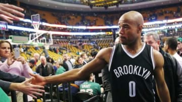 Dec 26, 2014; Boston, MA, USA; Brooklyn Nets guard Jarrett Jack (0) is congratulated by fans after their 109-107 win over the Boston Celtics at TD Garden. Mandatory Credit: Winslow Townson-USA TODAY Sports