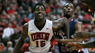 Feb 10, 2015; Las Vegas, NV, USA; UNLV Runnin' Rebels forward Dwayne Morgan (15) blocks out Fresno Bulldogs guard Marvelle Harris (23) during a game at Thomas & Mack Center. UNLV won the game 73-61. Mandatory Credit: Stephen R. Sylvanie-USA TODAY Sports