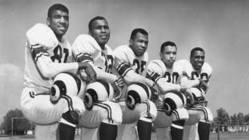 The 1953 Los Angeles Rams African-American players defensive back/offensive end Dick " Night Train " Lane, " fullback Deacon " Dan Towler, fullback Paul " Tank " Younger, halfback Woodley Lewis, and guard Hank Thompson. (Photo by Vic Stein/Getty Images)