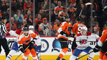 PHILADELPHIA, PA - MARCH 19: Claude Giroux #28 of the Philadelphia Flyers looks to pass the puck with teammates Sean Couturier #14 and Jakub Voracek #93 against Brendan Gallagher #11 of the Montreal Canadiens on March 19, 2019 at the Wells Fargo Center in Philadelphia, Pennsylvania. (Photo by Len Redkoles/NHLI via Getty Images)