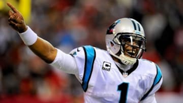 Dec 29, 2013; Atlanta, GA, USA; Carolina Panthers quarterback Cam Newton (1) reacts after a Panther touchdown against the Atlanta Falcons during the second quarter at the Georgia Dome. Mandatory Credit: Dale Zanine-USA TODAY Sports