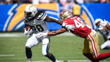 CARSON, CA - SEPTEMBER 30: Linebacker Fred Warner #48 of the San Francisco 49ers defends running back Melvin Gordon #28 of the Los Angeles Chargers in the first quarter at StubHub Center on September 30, 2018 in Carson, California. (Photo by Kevork Djansezian/Getty Images)