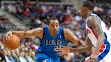 Feb 22, 2014; Auburn Hills, MI, USA; Detroit Pistons shooting guard Kentavious Caldwell-Pope (5) guards Dallas Mavericks shooting guard Wayne Ellington (21) during the fourth quarter at The Palace of Auburn Hills. Dallas won 113-102. Mandatory Credit: Tim Fuller-USA TODAY Sports