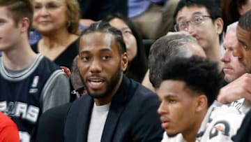 SAN ANTONIO,TX - FEBRUARY 28 : Kawhi Leonard of the San Antonio Spurs sits on the bench in street clothes during a game against the New Orleans Pelicans at AT
