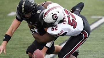Vanderbilt quarterback Ken Seals (8) fumbles as he’s hit by South Carolina defensive lineman Kingsley Enagbare (52) during the first quarter at Vanderbilt Stadium Saturday, Oct. 10, 2020 in Nashville, Tenn.Gw42703