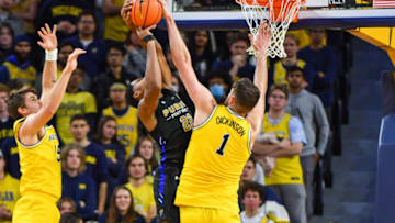 ANN ARBOR, MICHIGAN - NOVEMBER 07: Hunter Dickinson #1 of the Michigan Wolverines blocks a shot attempt by Anthony Roberts #22 of the Purdue Fort Wayne Mastodons during the second half of a college basketball game at Crisler Arena on November 7, 2022 in Ann Arbor, Michigan. The Michigan Wolverines won the game 75-56 over the Purdue Fort Wayne Mastodons. (Photo by Aaron J. Thornton/Getty Images)