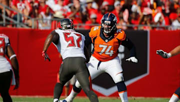 Oct 2, 2016; Tampa, FL, USA; Denver Broncos offensive tackle Ty Sambrailo (74) blocks as Tampa Bay Buccaneers defensive end Noah Spence (57) rushes during the first half at Raymond James Stadium. Mandatory Credit: Kim Klement-USA TODAY Sports