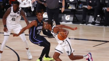Guard Jeremiah Martin, then of the Brooklyn Nets, drives. (Photo by Mike Ehrmann/Getty Images)