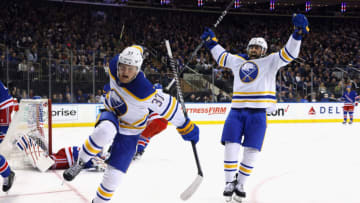 NEW YORK, NEW YORK - APRIL 10: Casey Mittelstadt #37 of the Buffalo Sabres celebrates his third period game-tying goal against the New York Rangers and is joined by Alex Tuch #89 at Madison Square Garden on April 10, 2023 in New York City. The Sabres defeated the Rangers 3-2 in the shootout. (Photo by Bruce Bennett/Getty Images)