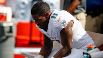 Oct 20, 2013; Miami Gardens, FL, USA; Miami Dolphins wide receiver Mike Wallace (11) on the bench in the fourth quarter against the Buffalo Bills at Sun Life Stadium. The Bills won 23-21. Mandatory Credit: Robert Mayer-USA TODAY Sports