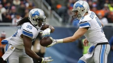 Jan 3, 2016; Chicago, IL, USA; Detroit Lions quarterback Matthew Stafford (9) hands off the football to Detroit Lions running back Joique Bell (35) against the Chicago Bears during the first half at Soldier Field. Mandatory Credit: Kamil Krzaczynski-USA TODAY Sports