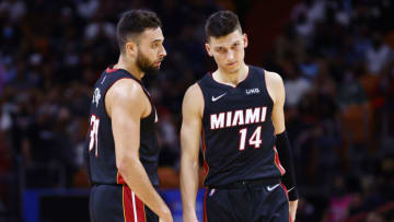 Max Strus #31 and Tyler Herro #14 of the Miami Heat look on against the Charlotte Hornets (Photo by Michael Reaves/Getty Images)