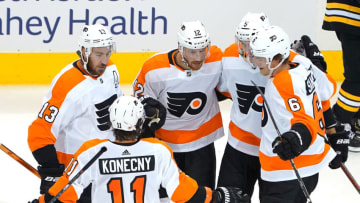 TORONTO, ONTARIO - AUGUST 02: Michael Raffl #12 of the Philadelphia Flyers is congratulated by teammates. (Photo by Andre Ringuette/Freestyle Photo/Getty Images)