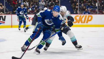 Feb 21, 2022; Vancouver, British Columbia, CAN; Seattle Kraken forward Jordan Eberle (7) stick checks Vancouver Canucks forward Vasily Podkolzin (92) in the second period at Rogers Arena. Mandatory Credit: Bob Frid-USA TODAY Sports