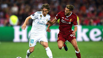 KIEV, UKRAINE - MAY 26: Luka Modric of Real Madrid CF competes for the ball with Adam Lallana of Liverpool during the UEFA Champions League final between Real Madrid and Liverpool on May 26, 2018 in Kiev, Ukraine. (Photo by David Ramos/Getty Images)
