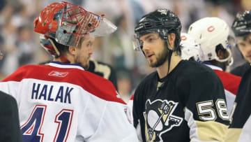 PITTSBURGH - MAY 12: Kris Letang #56 of the Pittsburgh Penguins shakes hands with Jaroslav Halak #41 of the Montreal Canadiens in Game Seven of the Eastern Conference Semifinals during the 2010 Stanley Cup Playoffs at Mellon Arena on May 12, 2010 in Pittsburgh, Pennsylvania.(Photo By Dave Sandford/Getty Images)