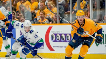 NASHVILLE, TN - APRIL 4: Colton Sissons #10 of the Nashville Predators skates against Quinn Hughes #43 of the Vancouver Canucks at Bridgestone Arena on April 4, 2019 in Nashville, Tennessee. (Photo by John Russell/NHLI via Getty Images)