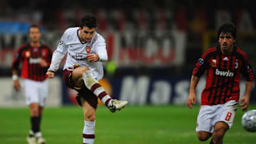 MILAN, ITALY - MARCH 04: Cesc Fabregas of Arsenal scores their opening goal during the UEFA Champions League 1st knockout round 2nd leg match between AC Milan and Arsenal at the San Siro stadium on March 4, 2008 in Milan, Italy. (Photo by Shaun Botterill/Getty Images)