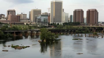 RICHMOND, VA - JULY 23: The Richmond skyline is viewed from across the James River on July 23, 2014 in Richmond, Virginia. According to a new study from the U.S. National Bureau of Economic Research, Richmond tops the table as America's most content city while New York City is the most unhappy. (Photo by Jay Paul/Getty Images)